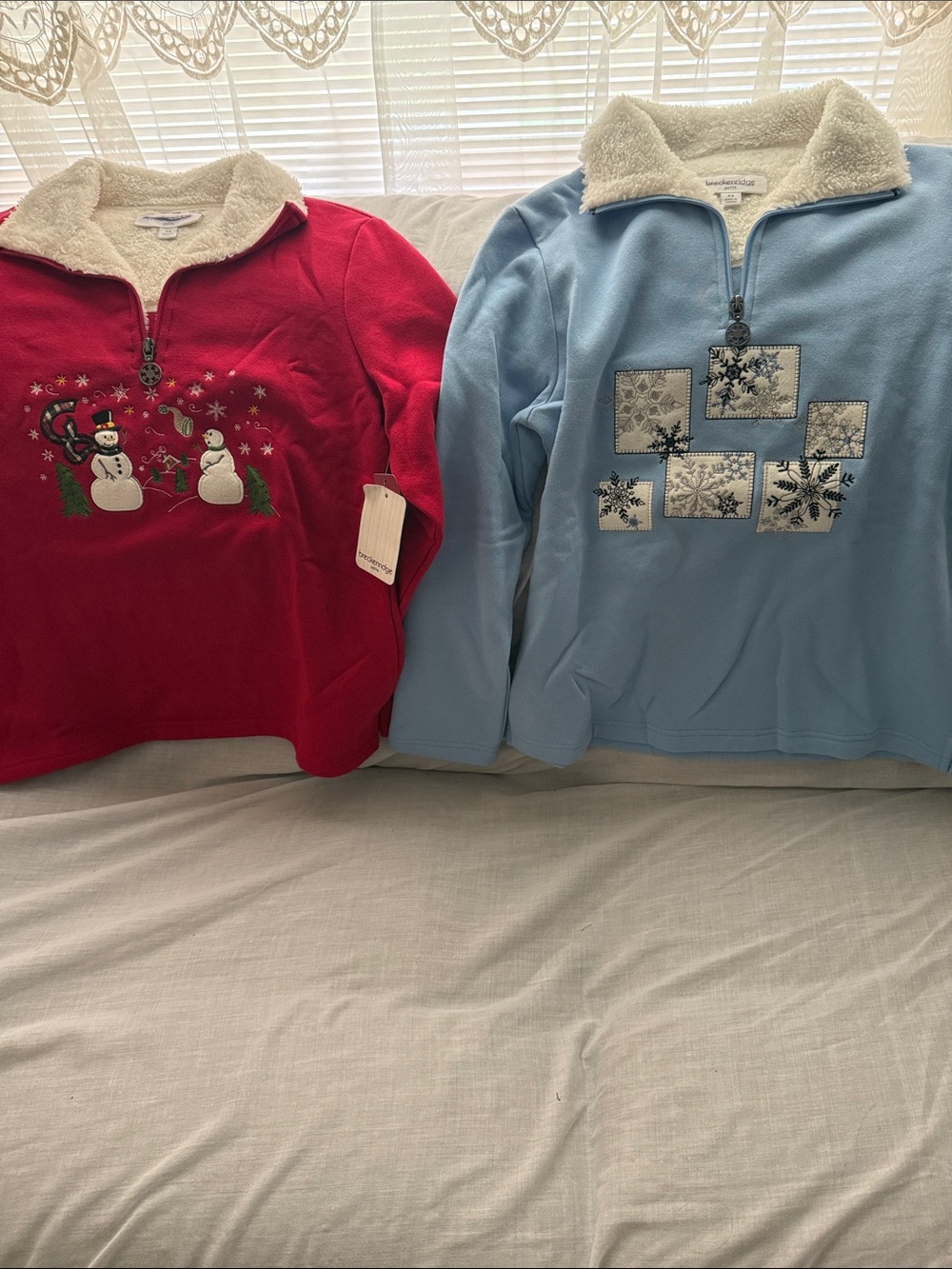 Pair of Sherpa-Trim Holiday Pullovers - Red & Light Blue. Size petite small